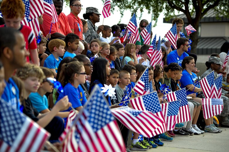 Children listen to the reading of the Month of the Military Child proclamation during the Month of the Military Child and Child Abuse Prevention Month kickoff at Hurlburt Field, Fla., April 1, 2015.  Hurlburt Field is home to more than 5,500 military children who face unique challenges related to military life and culture. (U.S. Air Force photo/Staff Sgt. Katherine Holt)