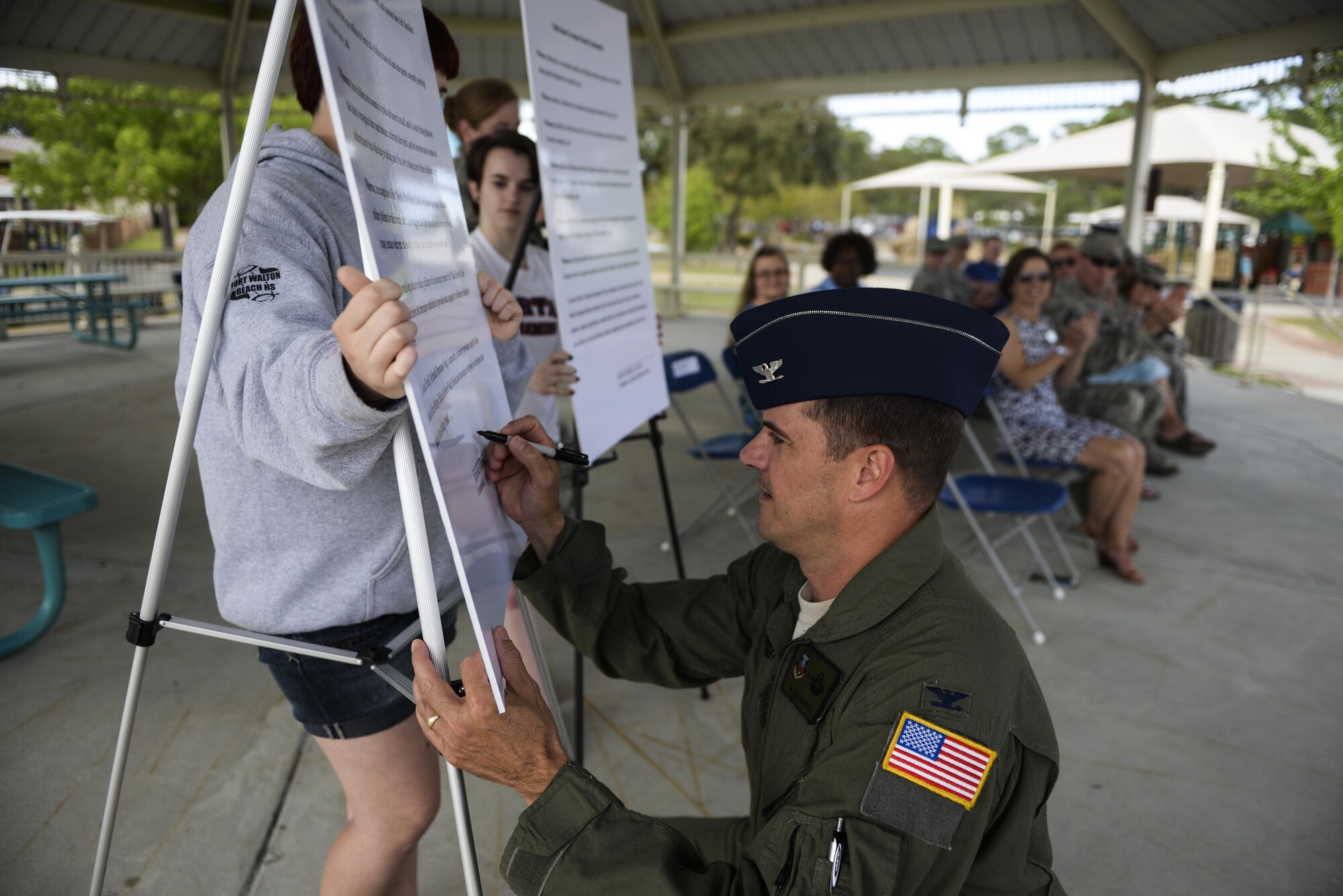 Col. Sean Farrell, 1st Special Operations Wing commander, signs a Month of the Military Child proclamation on Hurlburt Field, Fla., April 1, 2015. Additionally, Farrell signed a proclamation designating April as Child Abuse Prevention month. (U.S. Air Force photo/Senior Airman Christopher Callaway)  