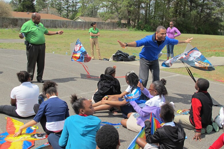 Huntsville Center's Energy Team talk to students about wind technology during Kite Day at Rolling Hills Elementary School.