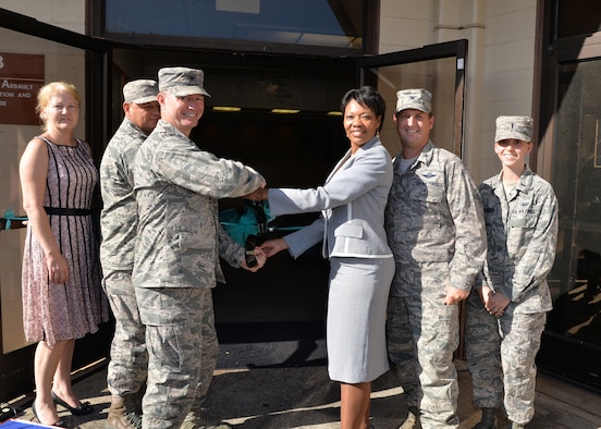 (From left to right) Ida Wallace, 15th Wing victim advocate, Chief Master Sgt. James Smith, 15th Wing command chief, Col. Randy Huiss, 15th Wing commander, Machelle Terrell, 15 Wing Sexual Assault Response Coordinator, Col.  Robert Cioppa 15th Wing vice commander, and 1st Lt. Molly Morrissey, deputy Sexual Assault Response Coordinator, participate in a ribbon cutting ceremony on Joint Base Pearl Harbor-Hickam, Hawaii, April 1, 2015. The Sexual Assault and Prevention office kicked-off Sexual Assault Awareness and Prevention Month with a ribbon cutting ceremony celebrating their newly renovated office. This year’s Sexual Assault Awareness and Prevention Month’s theme is, “Eliminate Sexual Assault: Know your part. Do your part.” (U.S. Air Force photo by Tech. Sgt. Aaron Oelrich/Released) 