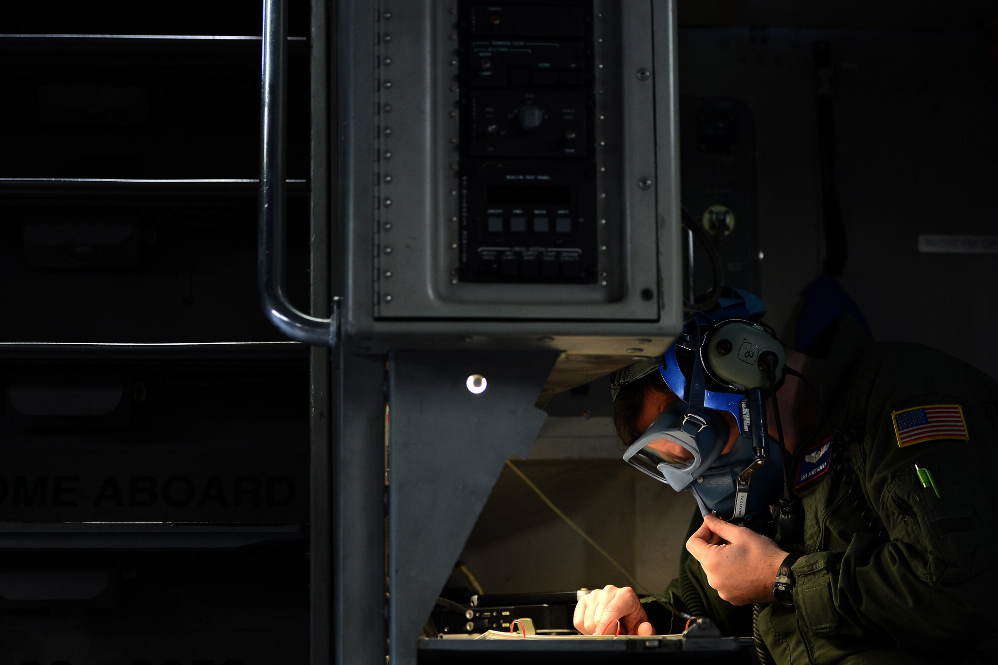 Staff Sgt. James Mabry, 4th Airlift Squadron loadmaster, prepares a C-17 Globemaster III for a mission April 2, 2015 at Joint Base-Lewis McChord, Wash. The C-17 crew conducted aerial refueling training as well as training on Semi Prepared Runway Operations at Fort Hunter-Liggett, Calif. (U.S. Air Force photo/ Staff Sgt. Tim Chacon)