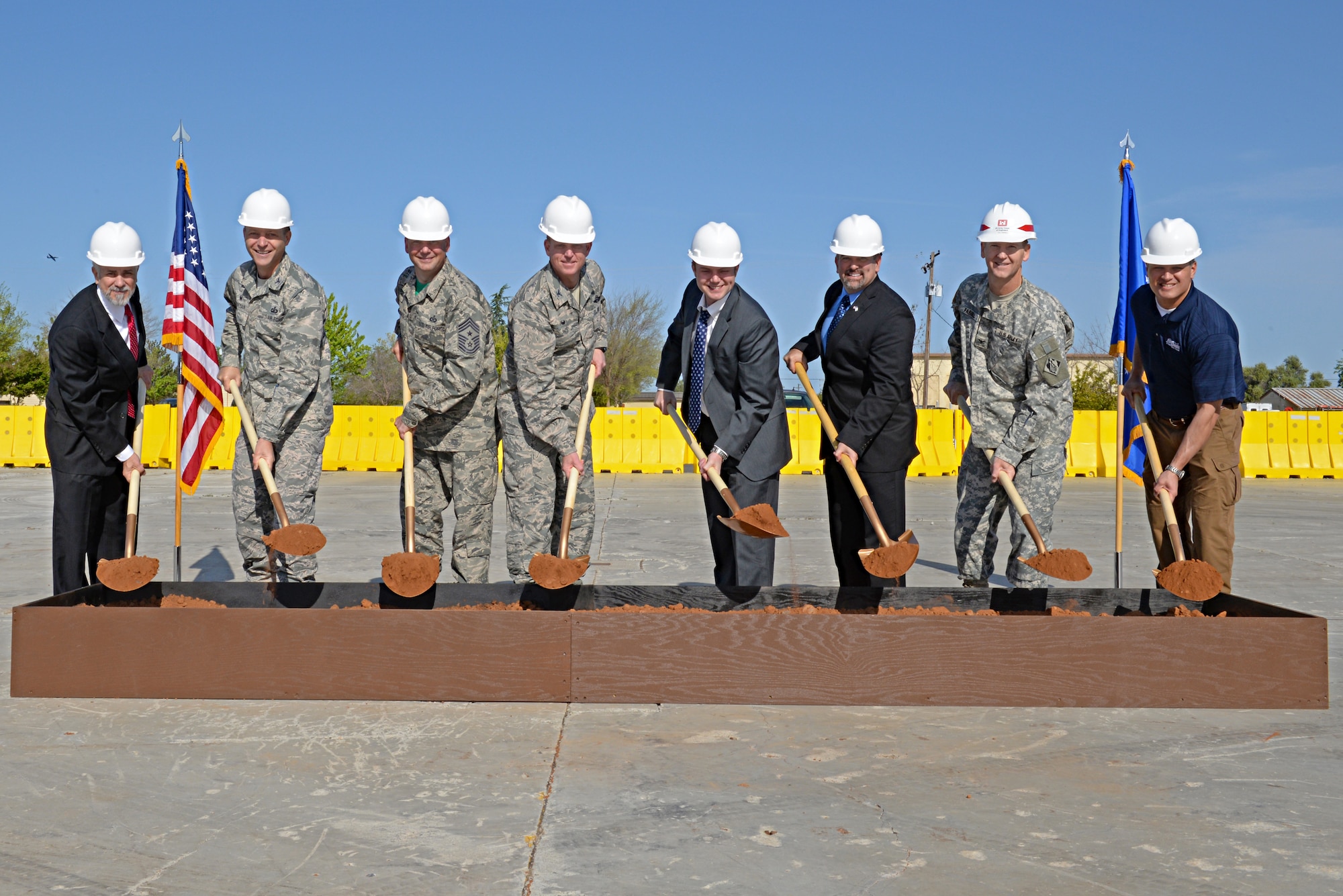 Beale leadership, Congressman John Garamendi representatives, a member of the Army Corps of Engineers, and the facility building contractors break ground for the initiation of construction of the 9th Civil Engineer Squadron Administration and Operations Facility at Beale Air Force Base, Calif., April 3, 2015. The 9th CES structure is planned to be a 43,000 square foot facility, costing $15.9 million. (U.S. Air Force photo by Airman 1st Class Ramon A. Adelan/Released)