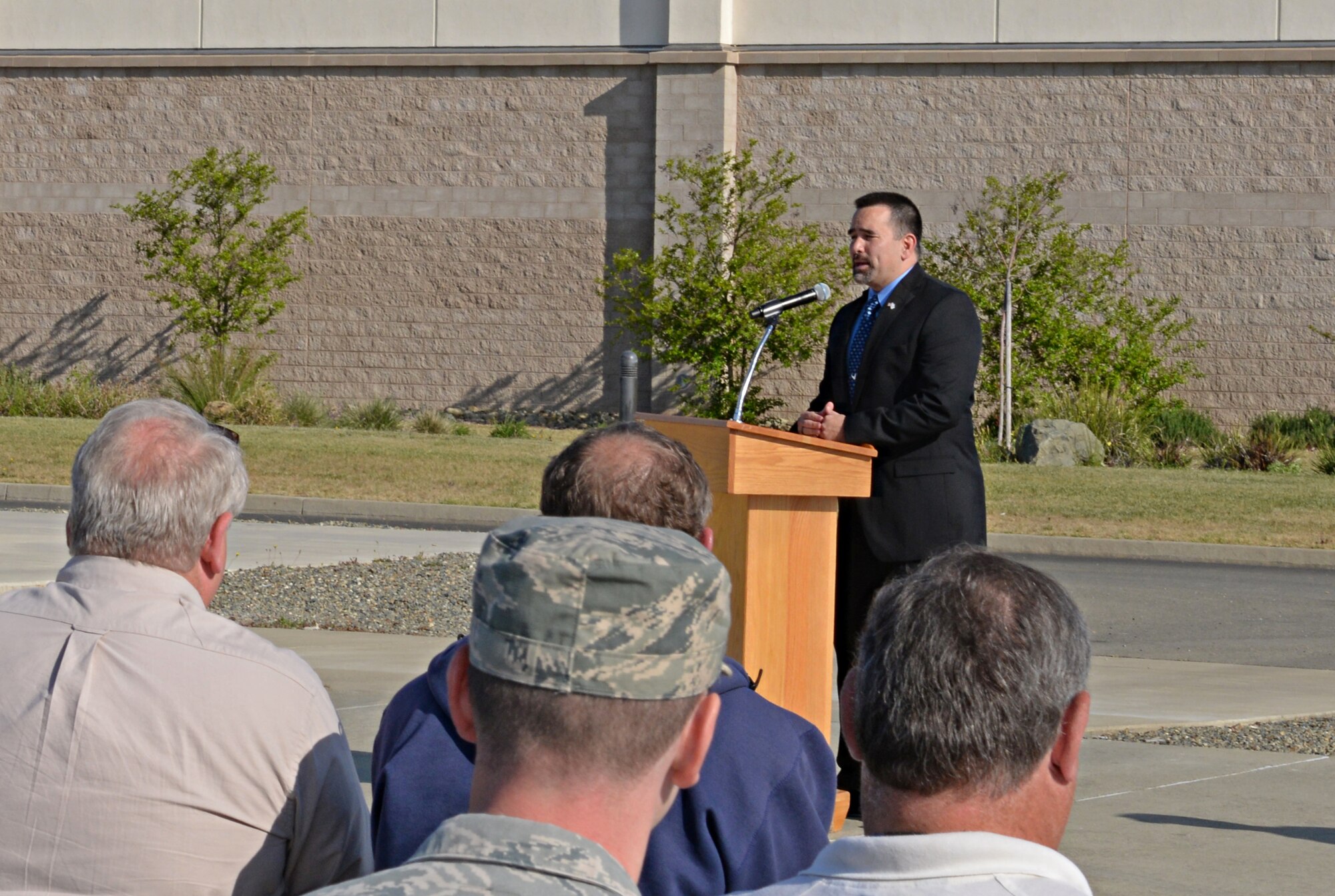 Chief Master Sgt. (Retired) John Evalle, Congressman John Garamendi’s military and veteran liaison, speaks to Team Beale during a groundbreaking ceremony initiating the official start of construction of the 9th Civil Engineer Squadron Administration and Operations Facility and the 548th Intelligence, Surveillance, and Reconnaissance Group Distribution Common Ground System Facility at Beale Air Force Base, Calif., April 3, 2015. The 9th CES structure is planned to be a 43,000 square foot facility, costing $15.9 million and the DCGS facility is planned to be a two-story 85,000 square foot structure, costing $53.7 million. (U.S. Air Force photo by Airman 1st Class Ramon A. Adelan/Released)