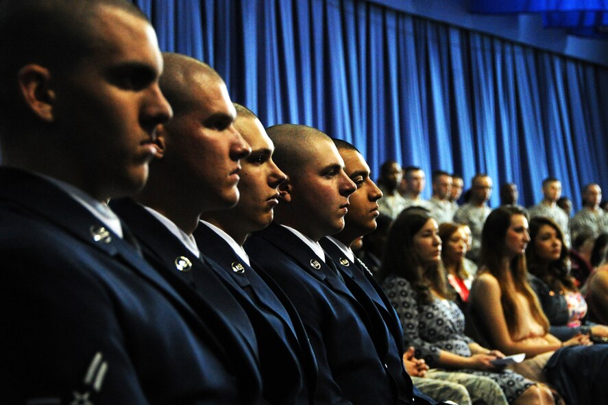 Honor Guardsmen students wait alongside their classmates during an Air Force Honor Guard graduation ceremony on Joint Base Anacostia-Bolling, Maryland, Apr 3, 2015. Airmen of every enlisted rank, and both company and field grade officers, volunteer and are competitively selected from their peers in more than 200 different Air Force career fields to serve in the Honor Guard. (U.S. Air Force photo/Staff Sgt. Matt Davis)