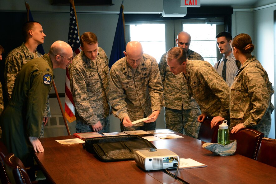 Commanders and senior leadership from multiple units on McChord Field examine different drug samples under the supervision of Andrew Kirk, Office of Special Investigations Detachment 305 special agent (right), Apr. 2, 2015, at Joint Base Lewis-McChord, Wash. Members of Det. 305 showed the group a variety of illegal substances and explained the dangers of synthetic substances like Spice, as well as cases that involved illegal drug use on McChord within the last year. (U.S. Air Force photo/Senior Airman Rebecca Blossom)