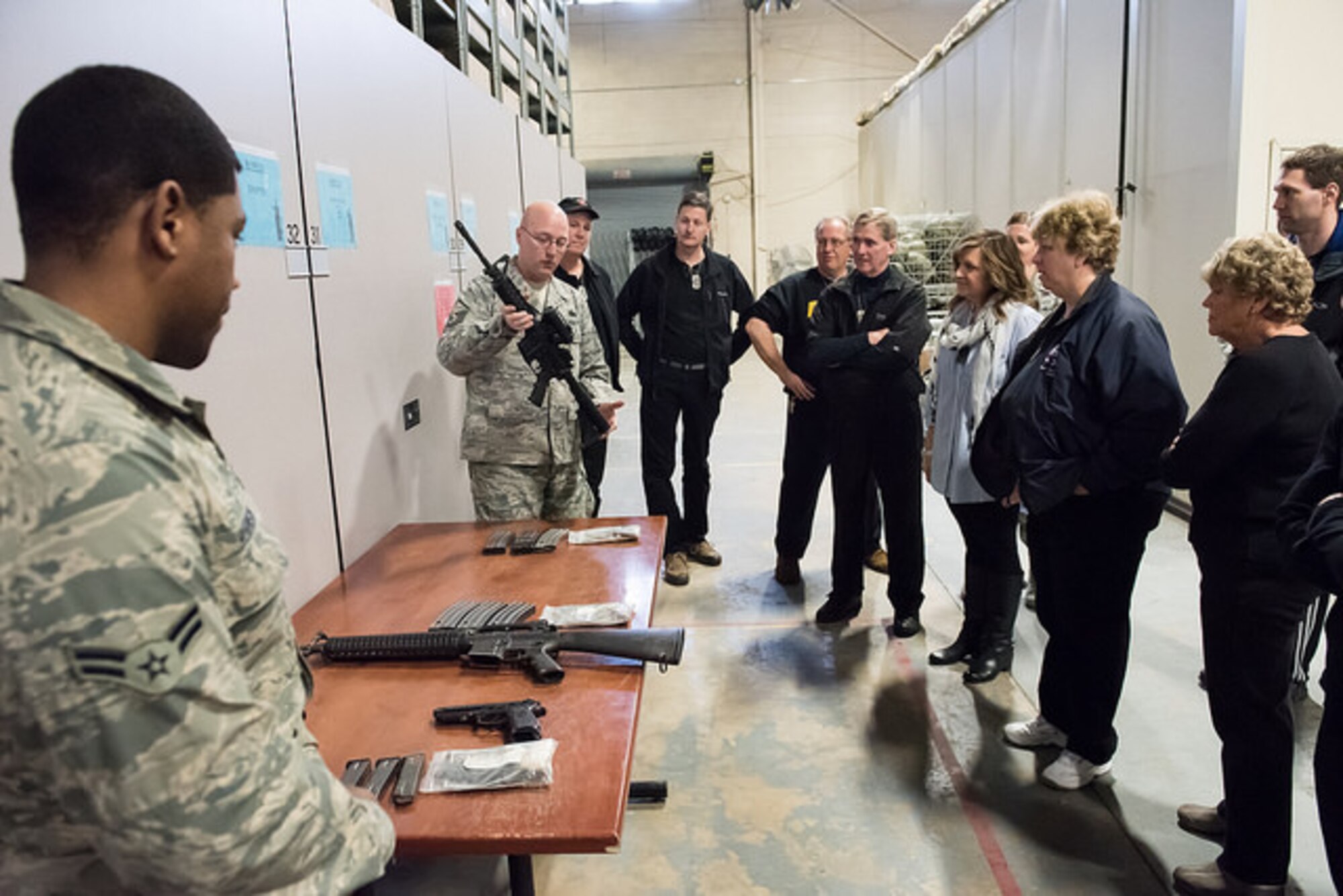 Honorary commanders observe weapons issuing procedures March 26, 2015, on Joint Base McGuire-Dix-Lakehurst, N.J. The honorary commander program encourages an exchange of ideas and experiences between key civilian leaders of the surrounding communities and JB MDL leaders.
 (U.S. Air Force photo by Russ Meseroll/Released)
