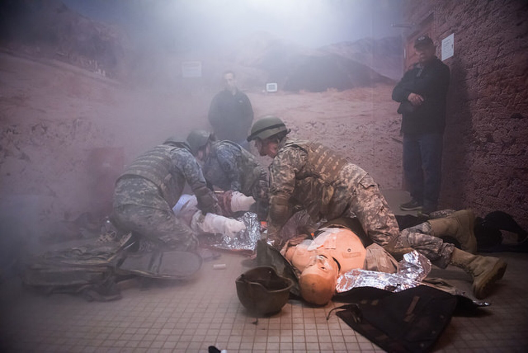 A combat medical response exercise is demonstrated for honorary commanders March 26, 2015, on Joint Base McGuire-Dix-Lakehurst, N.J. Operation Victory was a simulated mission demonstrating military capabilities to community leaders. It is part of a continuing educational series showcasing service members’ support for Joint Base McGuire-Dix-Lakehurst missions and preparations for global operations. (U.S. Air Force photo by Russ Meseroll/Released)