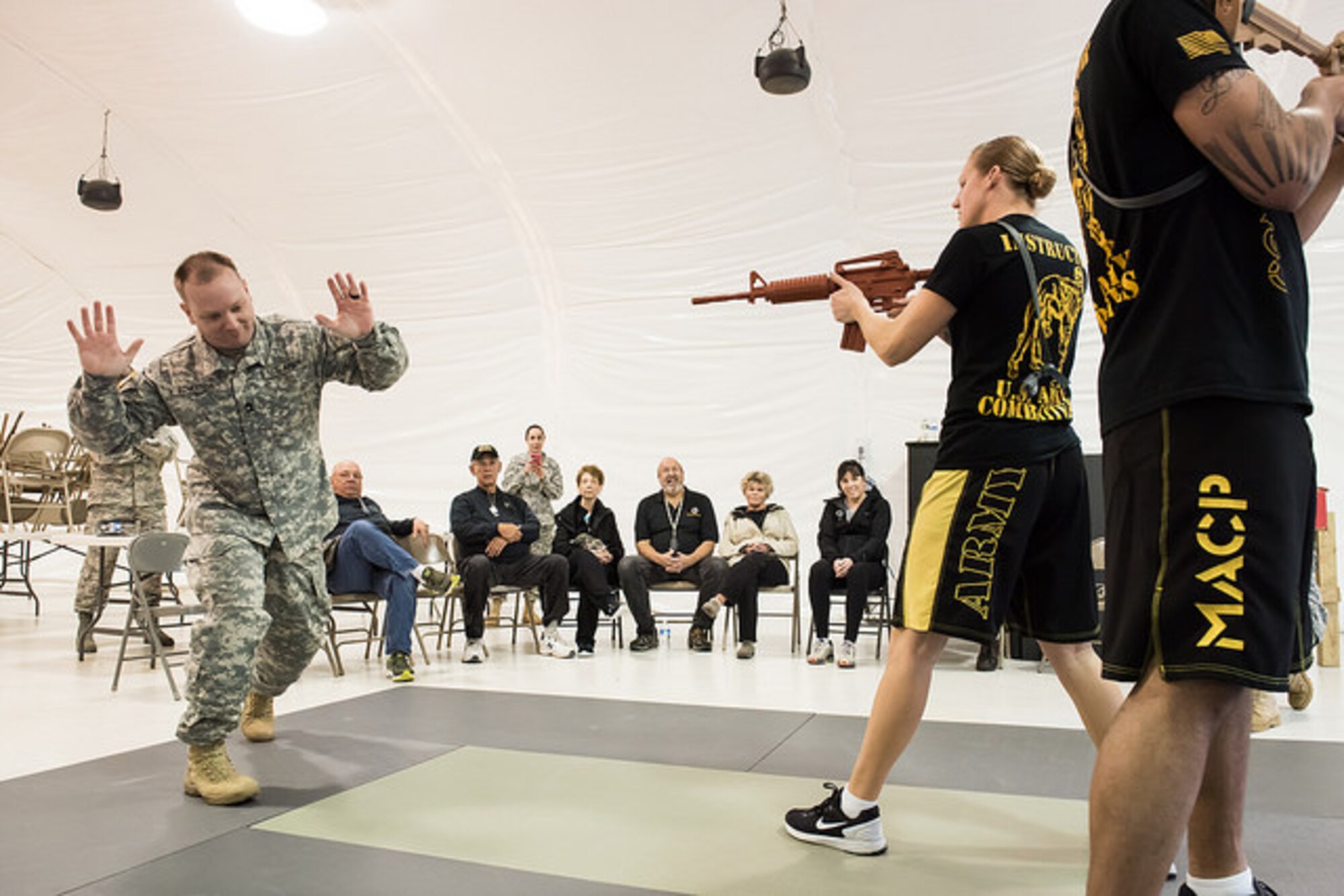 Honorary commanders view an Army combatives demonstration March 26, 2015 on Joint Base McGuire-Dix-Lakehurst, N.J. The honorary commander program encourages an exchange of ideas and experiences between key civilian leaders of the surrounding communities and JB MDL leaders.  (U.S. Air Force photo by Russ Meseroll/Released)