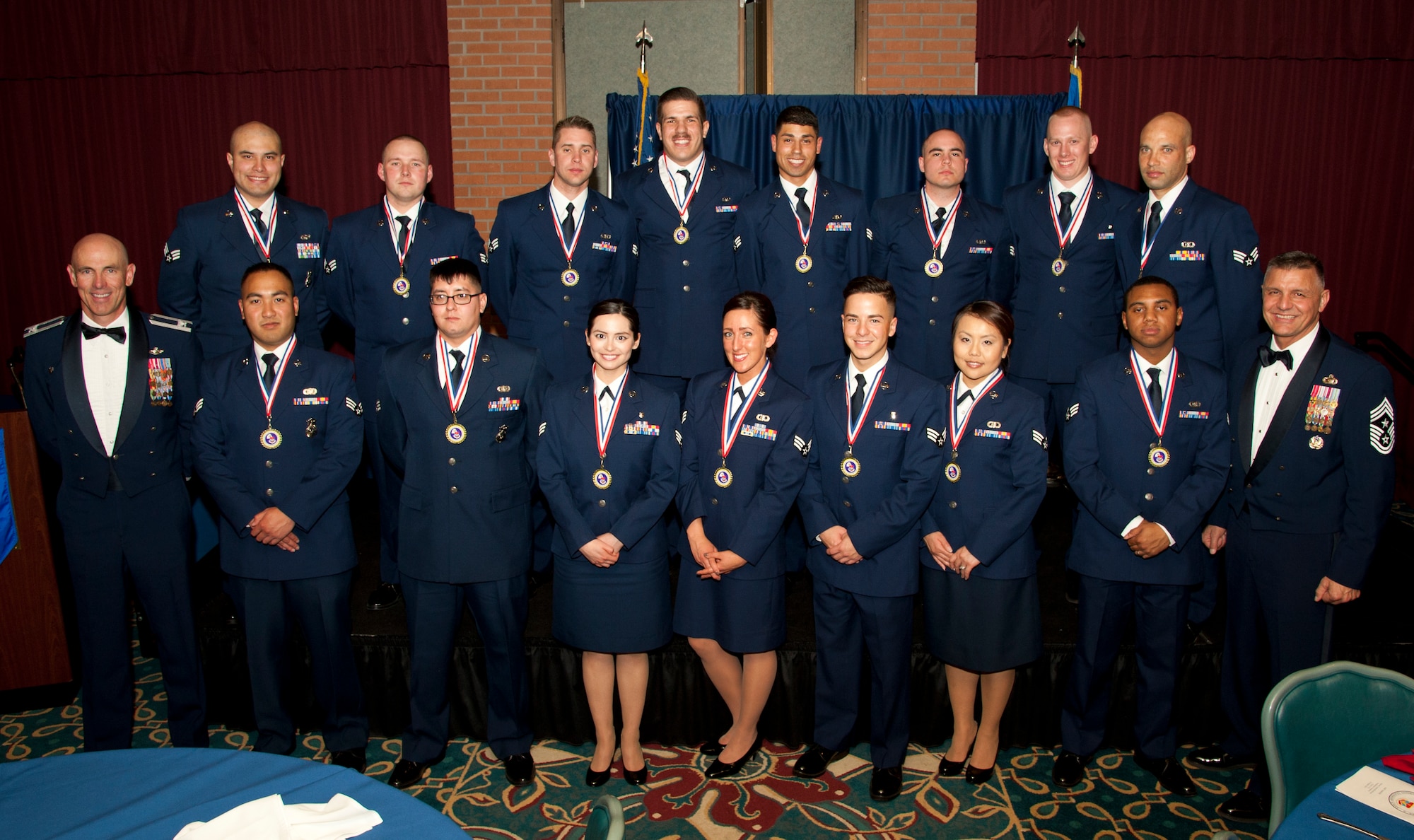 71st Flying Training Wing leadership stands with the graduates of Vance’s first-ever Airman Leadership School class during a ceremony March 25 at the Vance Collocated Club. Fifteen Vance Airmen graduated the course, which is the first step to becoming front-line supervisors. (U.S. Air Force photo\Tech. Sgt. James Bolinger)