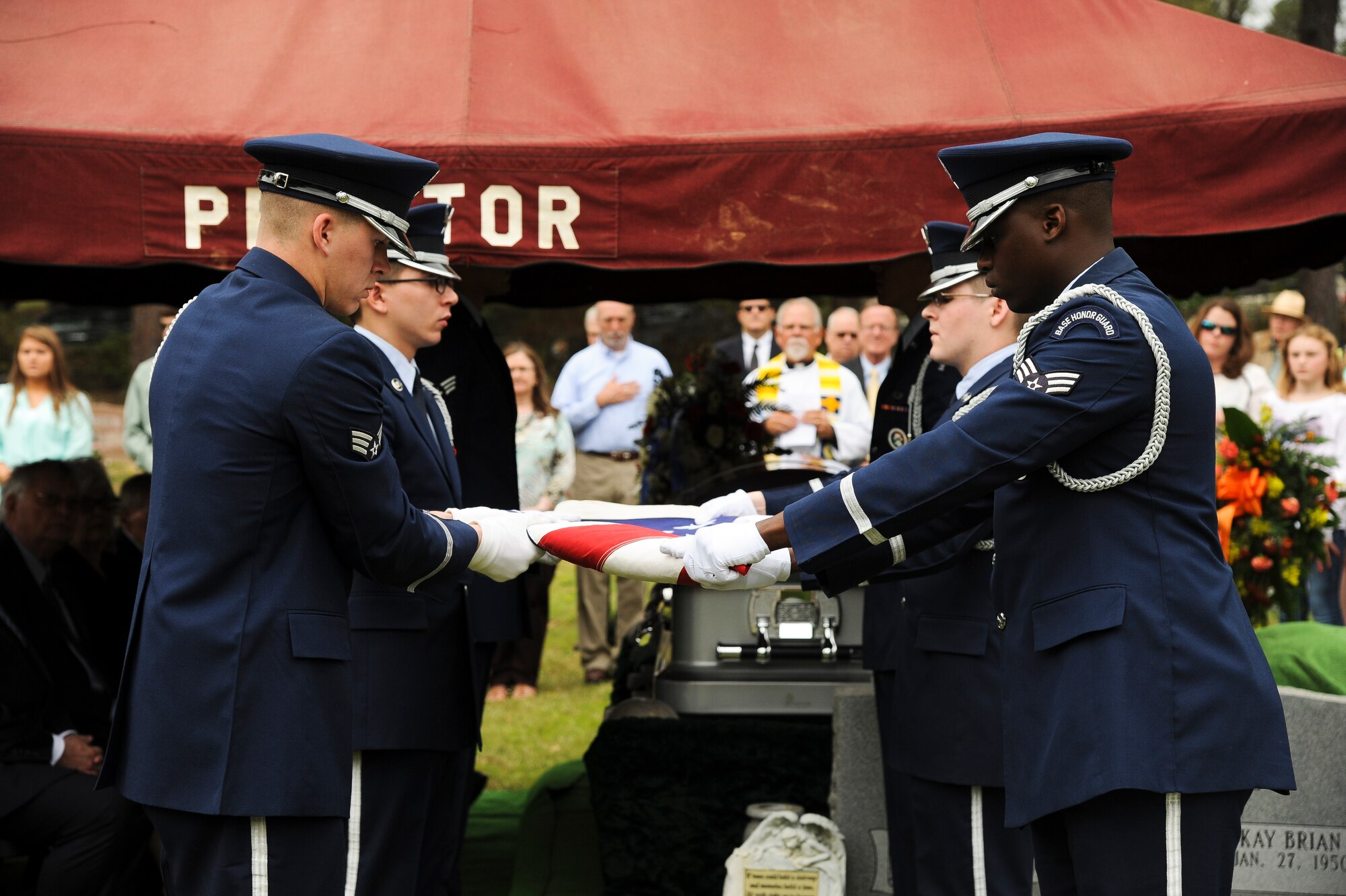 Members of the Little Rock Air Force Base Honor Guard perform a flag-folding ceremony to honor Lt. Col. Robert Hite, a World War II Doolittle Raider, April 2, 2015, during his funeral in Camden, Ark. Hite was a Japanese prisoner of war for 40 months following the bombing raids until his release Aug. 20, 1945. (U.S. Air Force photo by Airman 1st Class Mercedes Muro)