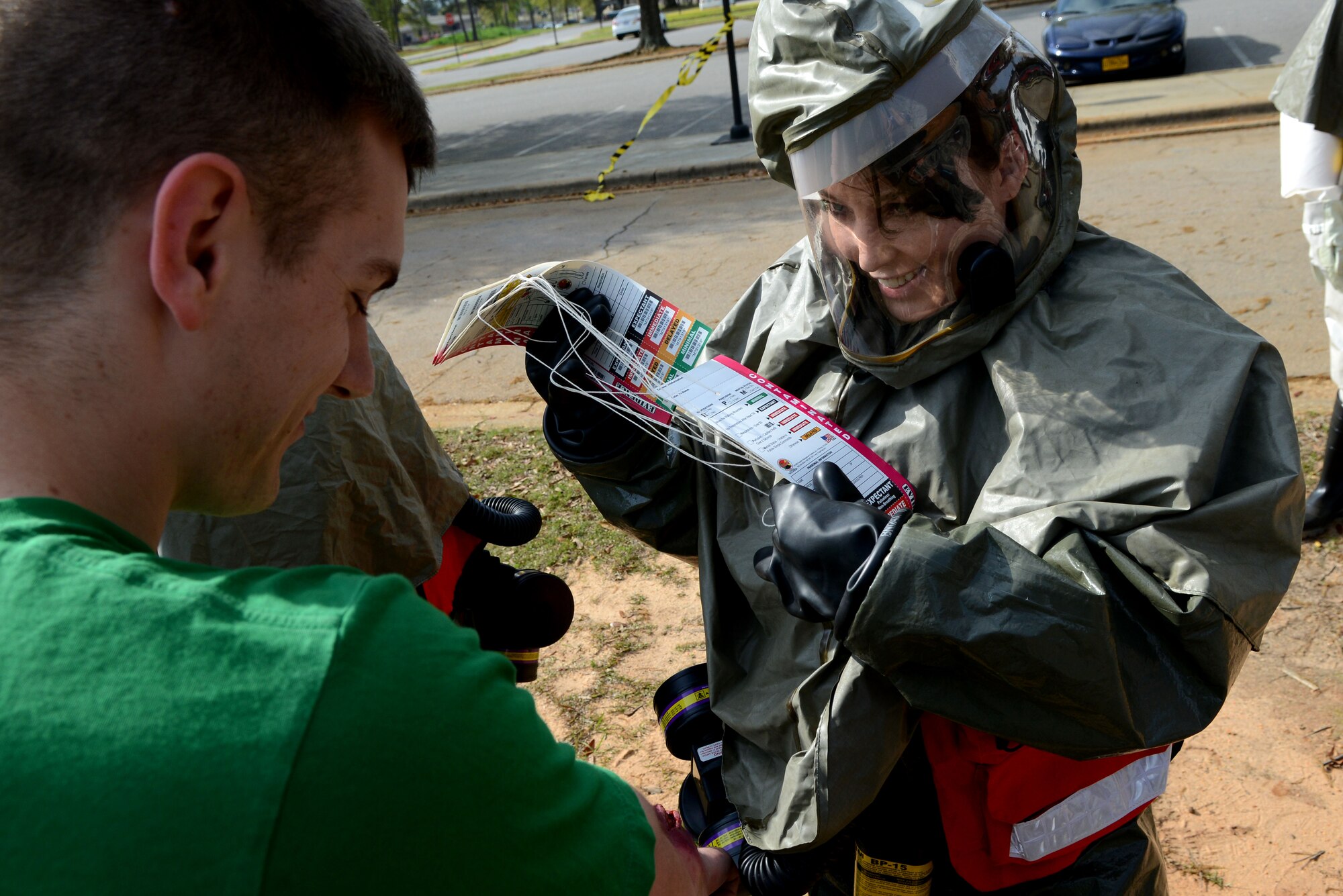 A U.S. Air Force Airman assigned to the 20th Medical Group assesses a simulated patient during a mass accident response exercise at Shaw Air Force Base, S.C., April 3, 2015. Simulated injuries and deaths ranged from a sprained wrist, to burns, and post-traumatic stress disorder. (U.S. Air Force photo by Airman 1st Class Michael Cossaboom/Released)