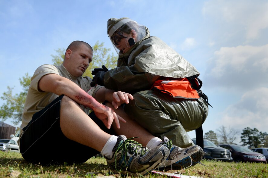 A U.S. Air Force Airman assigned to the 20th Medical Group assesses a simulated patient during a mass accident response exercise at Shaw Air Force Base, S.C., April 3, 2015. The exercise’s intent was to test Airmen’s ability to handle pressure under adverse situations and effectively triage patients. (U.S. Air Force photo by Airman 1st Class Michael Cossaboom/Released)