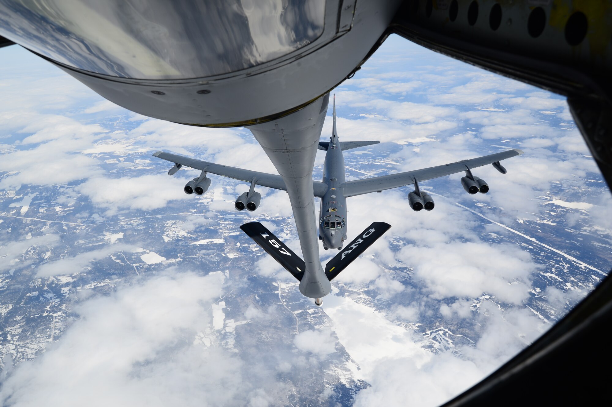 Pilots flying a B-52H from Barksdale Air Force Base, La. prepare to receive fuel from a New Hampshire Air National Guard KC-135R April 2, 2015, near the eastern coast of Canada.  The B-52H was returning home after supporting a U.S. Strategic Command-directed mission to the Arctic and North Sea regions called "Polar Growl.” The mission was to provide a flexible and visible signal that highlights the U.S. ability to deter strategic attacks and respond to any potential future crisis or challenge. (New Hampshire Air National Guard photo by Airman Ashlyn J. Correia)