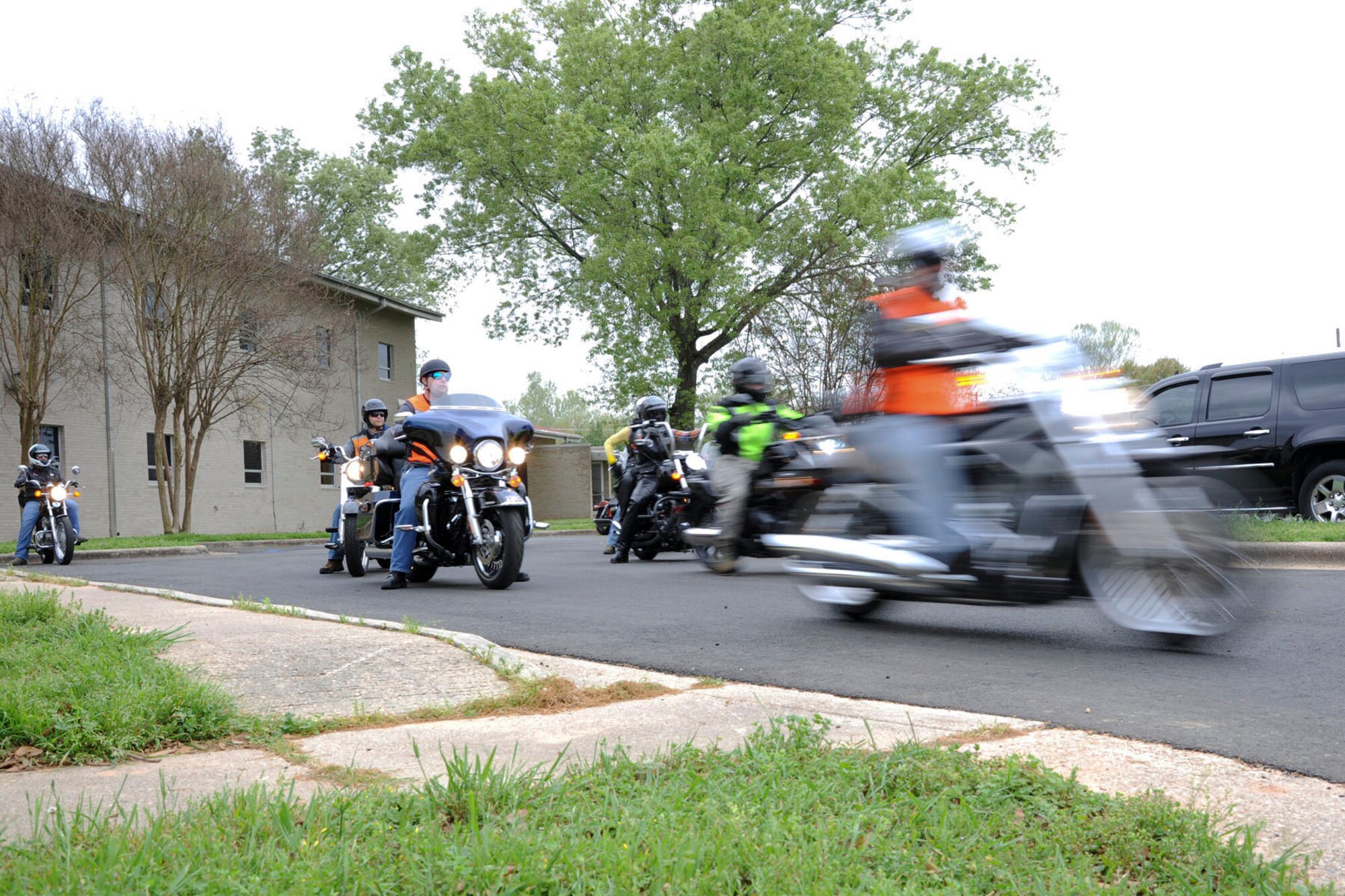 Motorcycle enthusiasts depart from Chapel 2 during the 4th Annual Thunder on the Bayou motorcycle ride on Barksdale Air Force Base, La., April 5, 2014. Airmen are required to wear approved helmets, gloves and sturdy over-the-ankle foot wear as part of their personal protective equipment. (U.S. Air Force photo/ Senior Airman Jannelle Dickey)
