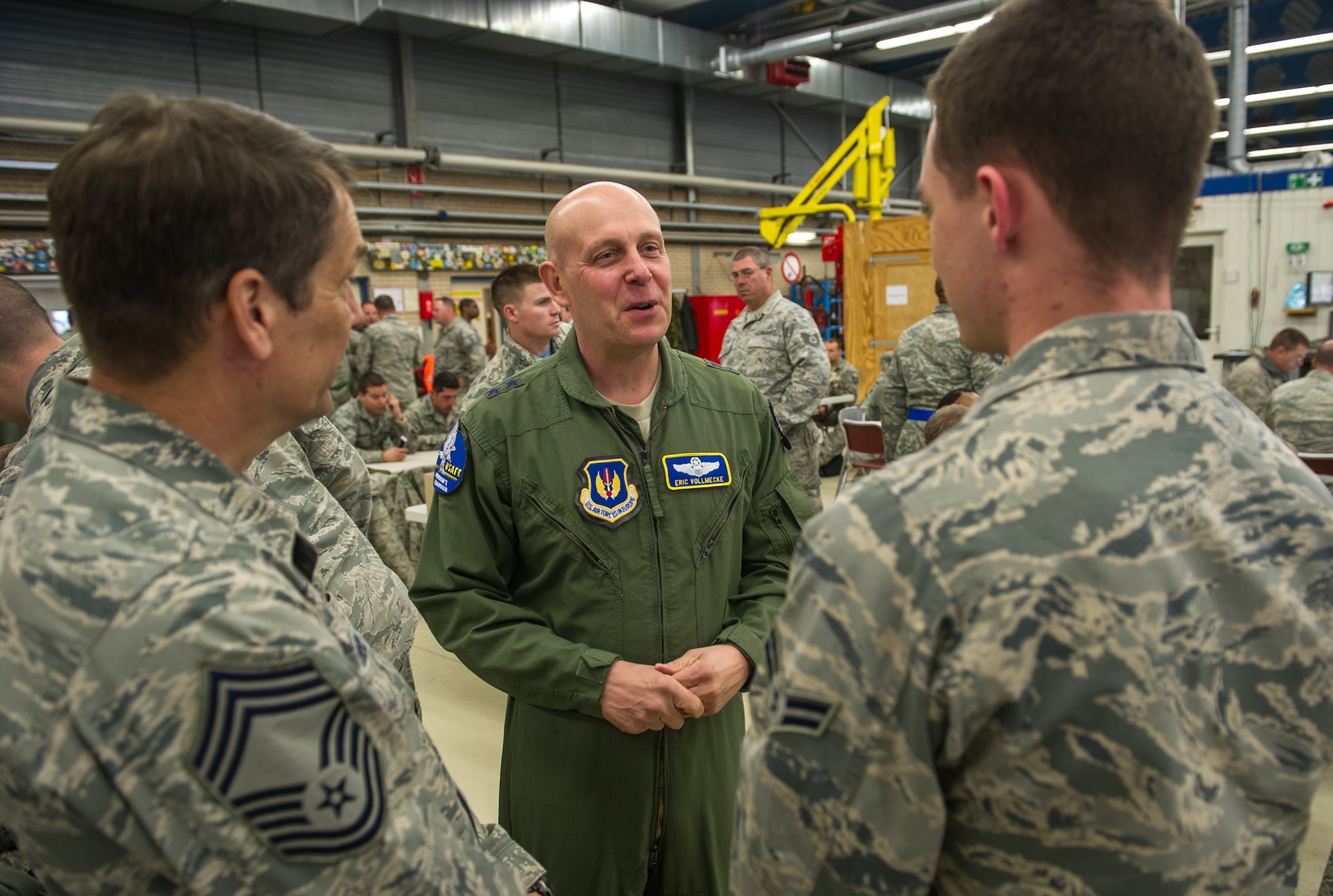 Maj. Gen. Eric Vollmecke speaks to Airmen about their role in the current theater security package of F-15C Eagles at Leeuwarden Air Base, Netherlands, April 3, 2015. The F-15s from the Florida and Oregon Air National Guard are deployed to Europe as the first ever ANG TSP here. These F-15s will conduct training alongside our NATO allies to strengthen interoperability and to demonstrate U.S. commitment to the security and stability of Europe. Vollmecke is the ANG mobilization assistant to the Commander, U.S. Air Forces in Europe and Air Forces Africa. (U.S. Air Force photo/ Staff Sgt. Ryan Crane)