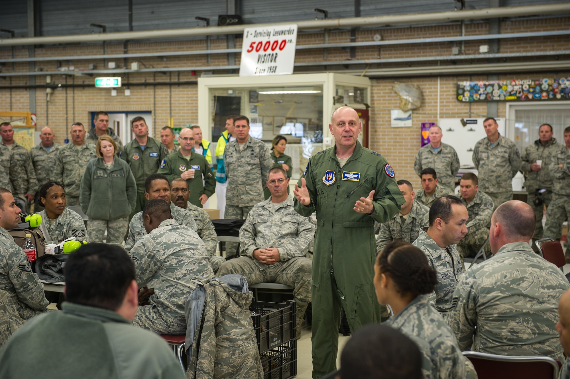 Maj. Gen. Eric Vollmecke speaks to Airmen about their role in the current theater security package of F-15C Eagles at Leeuwarden Air Base, Netherlands, April 3, 2015. The F-15s from the Florida and Oregon Air National Guard are deployed to Europe as the first ever ANG TSP here. These F-15s will conduct training alongside our NATO allies to strengthen interoperability and to demonstrate U.S. commitment to the security and stability of Europe. Vollmecke is the ANG mobilization assistant to the Commander, U.S. Air Forces in Europe and Air Forces Africa. (U.S. Air Force photo/ Staff Sgt. Ryan Crane)