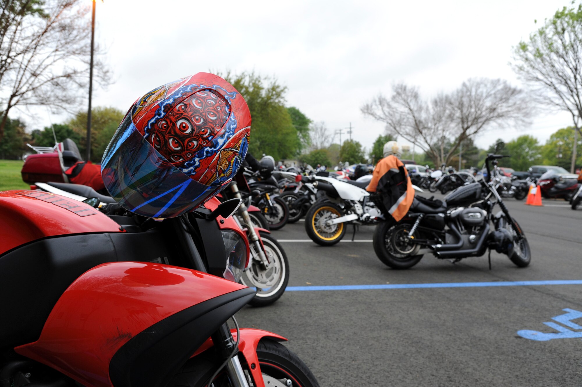 A helmet rests on the handle bars of a motorcycle prior to the 4th Annual Thunder on the Bayou event on Barksdale Air Force Base, La., April 3, 2015. The event promoted Barksdale motorcycle enthusiasts to learn about proper motorcycle safety and personal protective equipment, while also encouraging mentorship and camaraderie. (U.S. Air Force photo/ Senior Airman Jannelle Dickey)
