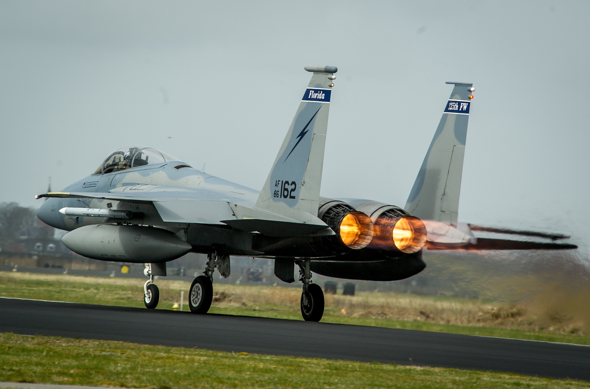 An F-15C Eagle from the 159th Expeditionary Fighter Squadron takes off for a training flight with the Royal Netherlands Air Force F-16 Fighting Falcons at Leeuwarden Air Base, Netherlands, April 3, 2015. The F-15s from the Florida and Oregon Air National Guard are deployed to Europe as the first ever ANG TSP here. These F-15s will conduct training alongside our NATO allies to strengthen interoperability and to demonstrate U.S. commitment to the security and stability of Europe. (U.S. Air Force photo/ Staff Sgt. Ryan Crane)