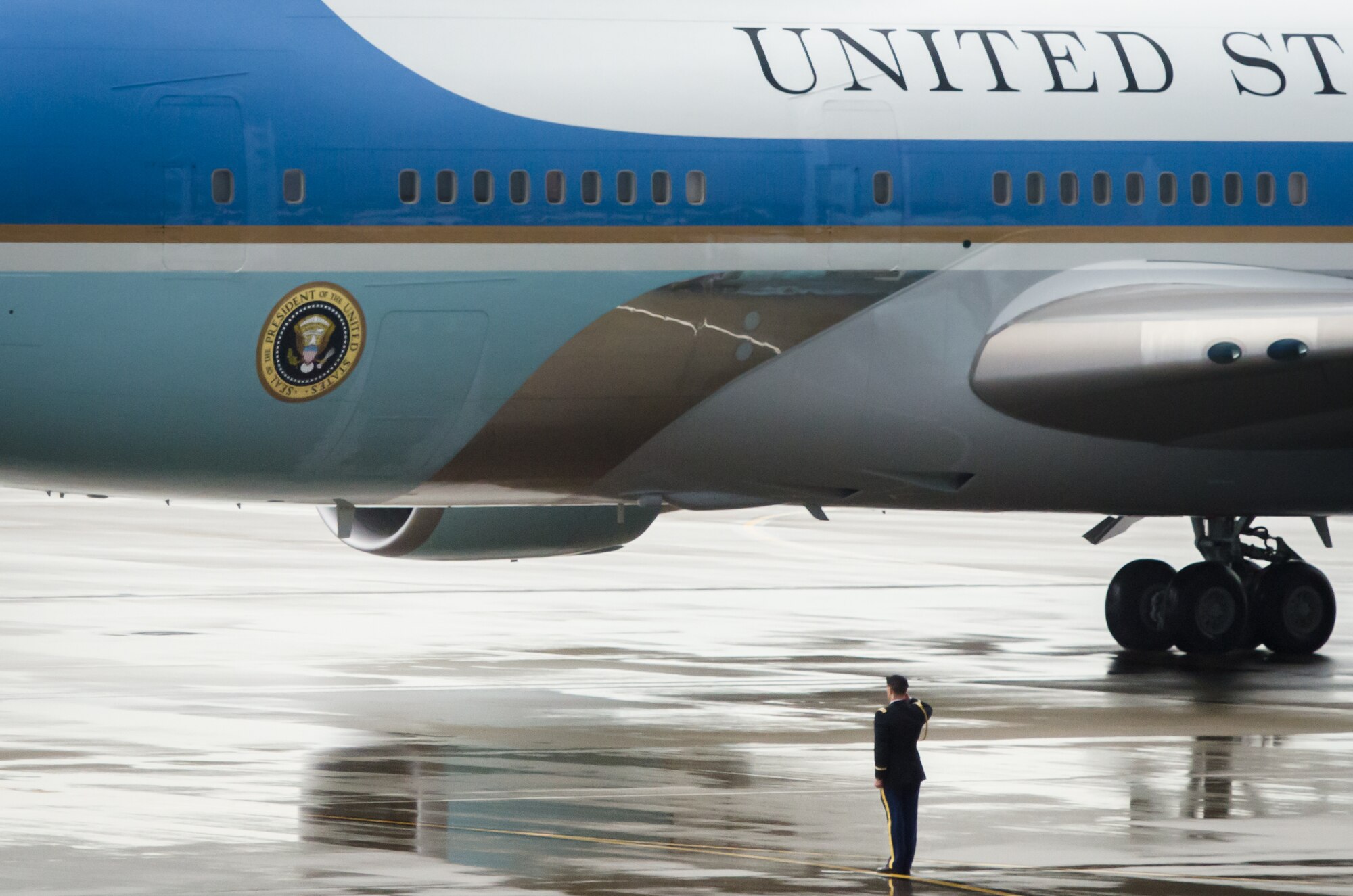 A U.S. Army Soldier salutes Air Force One April 2, 2015, as it arrives at the Kentucky Air National Guard Base in Louisville, Ky., carrying President Barack Obama. The president was in town to speak about job training and economic development. (U.S. Air National Guard photo by Maj. Dale Greer)