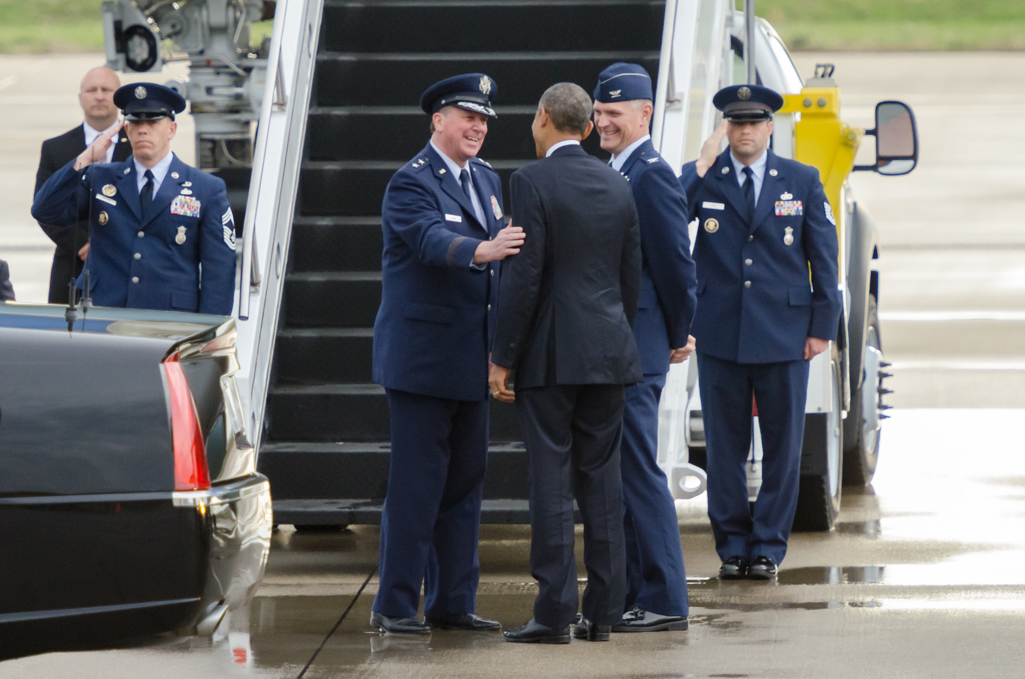 President Barack Obama (center) talks with Maj. Gen. Edward Tonini (near left), adjutant general of the Commonwealth of Kentucky, and Col. Barry Gorter (near right), commander of the 123rd Airlift Wing, on the flight line of the Kentucky Air National Guard Base in Louisville, Ky., April 2, 2015. Obama was in town to discus job training and economic development during a visit to Indatus, a Louisville technology company that focuses on cloud-based applications. (U.S. Air National Guard photo by Maj. Dale Greer)