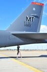 A B-52H Stratofortress crewmember performs safety checks before a training mission on Minot Air Force Base, N.D., April 1, 2015. The training mission, coined “POLAR GROWL”, aims to provide unique training opportunities while testing the bomber force’s command and control apparatus’ ability to support two synchronized flight paths. (U.S. Air Force photos/Senior Airman Malia Jenkins)