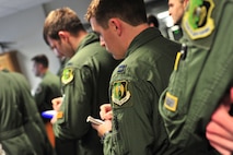 B-52H Stratofortress crewmembers listen to mission briefs before a training mission on Minot Air Force Base, N.D., April 1, 2015. The mission involved simultaneous flights from B-52s assigned to Minot AFB and Barksdale Air Force Base to the Arctic and North Sea regions, respectively. (U.S. Air Force photos/Senior Airman Malia Jenkins)   