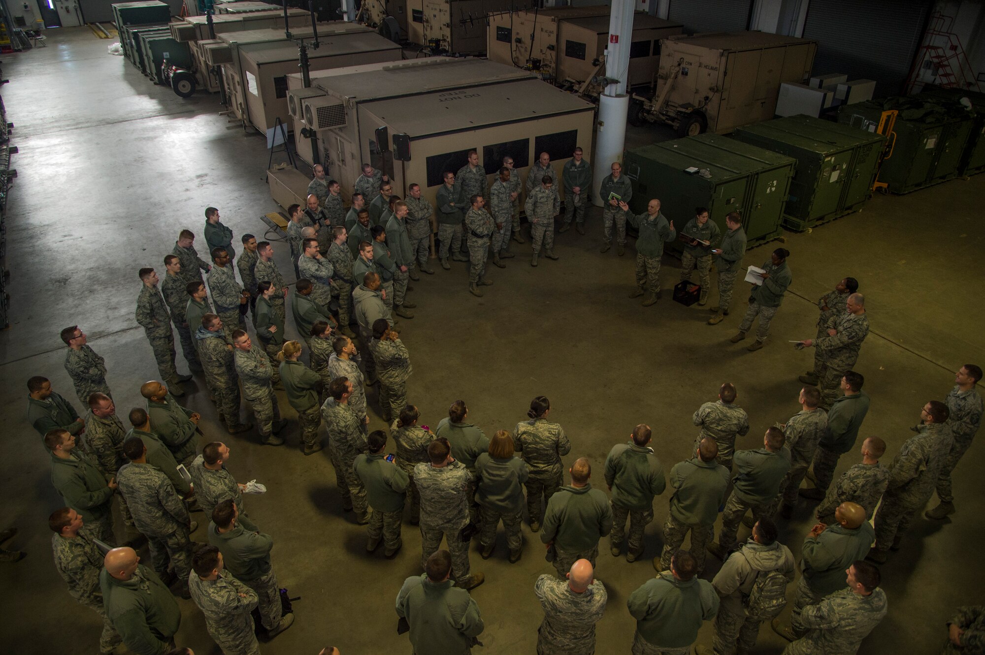 Airmen gather to prepare for the Devil Raid Mobility Exercise competition at Joint Base McGuire-Dix-Lakehurst, N.J., March 31, 2015. Approximately 225 members of the 818th and 817th Contingency Response Groups participated in the exercise. (U.S. Air Force photo/Staff Sgt. Gustavo Gonzalez/RELEASED)