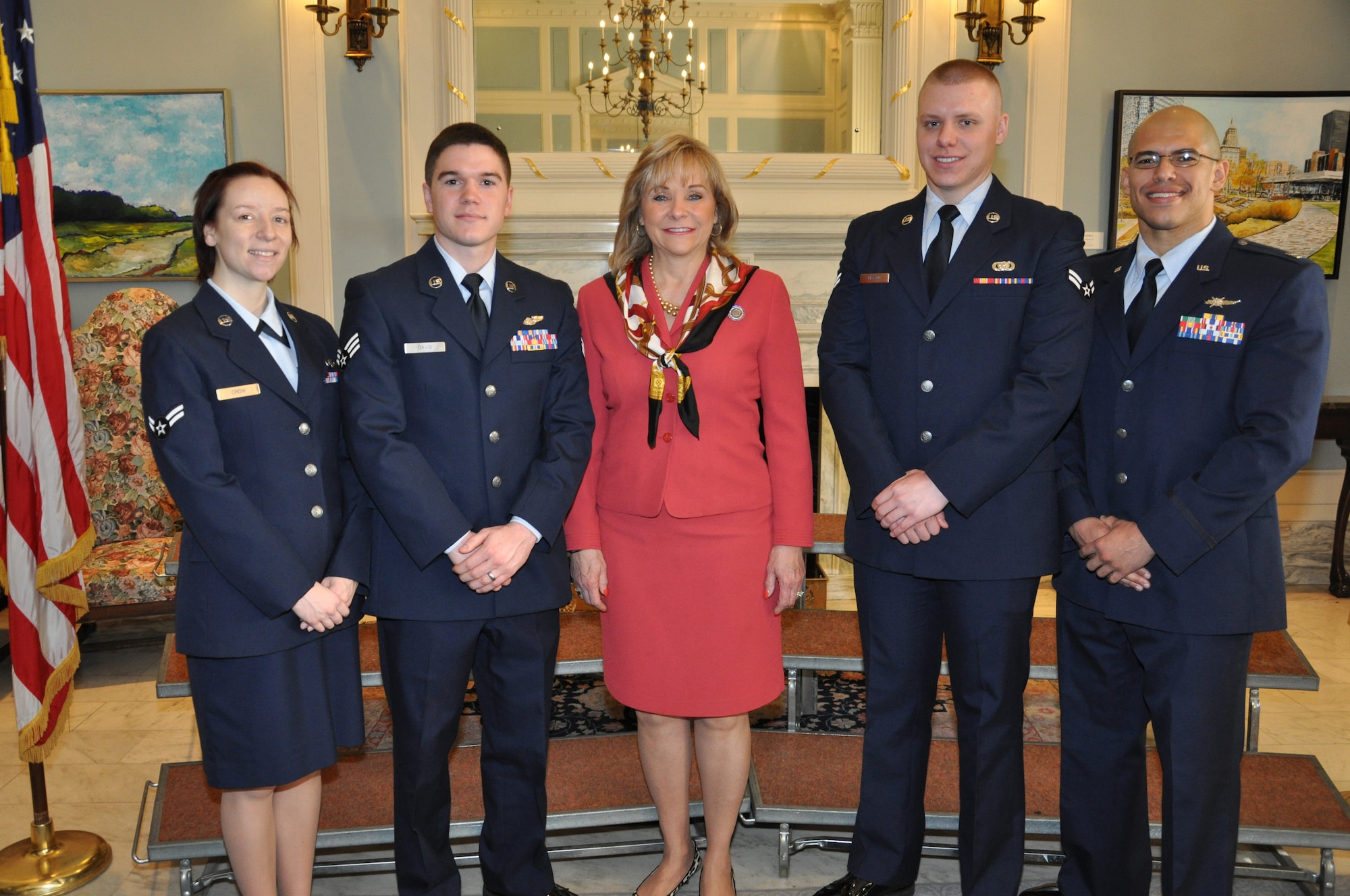 Air Force photo by Darren D. Heusel
Airmen with the 552nd Air Control Wing at Tinker Air Force Base pose for a photograph with Oklahoma Gov. Mary Fallin Wednesday at the State Capitol. Governor Fallin recognized the Airmen and thanked them for their efforts in helping to promote the career fields of Science, Technology, Engineering and Math during the 26th Annual Student Inventor’s Exposition held March 24 at Rose State College. Pictured from Tinker are: from left, Airman 1st Class Tatiana Crow, 552nd Air Control Network Squadron; Senior Airman Christopher Davis, 552nd Training Squadron; Airman 1st Class Damion Martin, 552nd Maintenance Squadron; and Capt. Ivan Richards, 752nd Operations Support Squadron.

