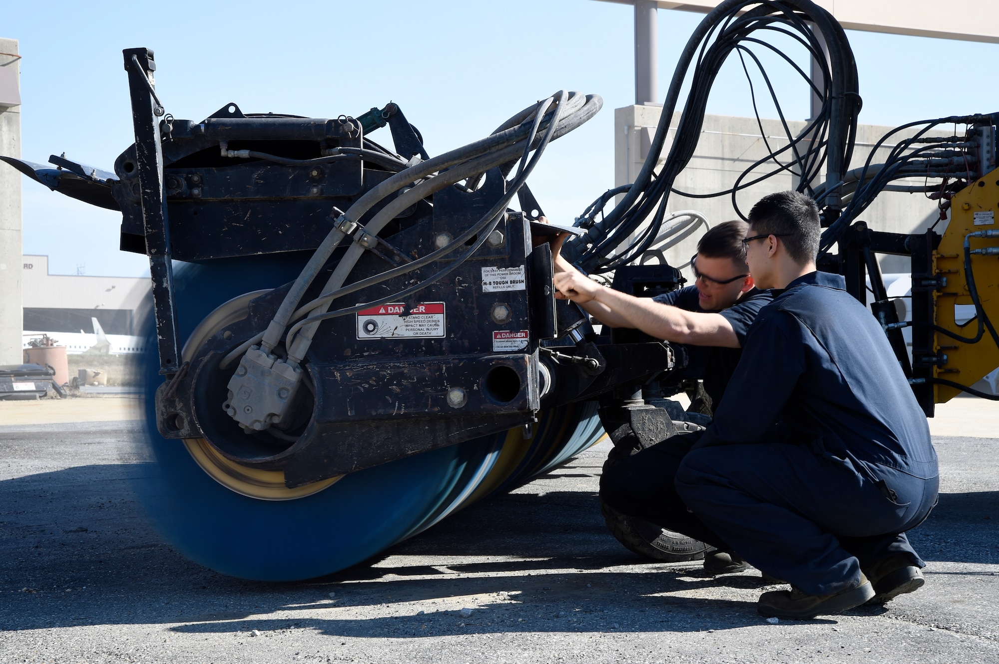 Airman Yoon Kim, right, and Senior Airman Jonathan Boone, 11th Logistics Readiness Squadron vehicle maintainers, inspect the limiter on a runway broom during an operations check at Joint Base Andrews, Md., April 2, 2015. Ops checks are made to ensure equipment is functioning properly and safely. (U.S. Air Force photo/Airman 1st Class Ryan J. Sonnier)