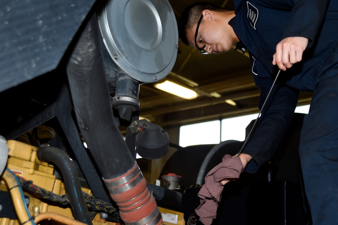 Airman Yoon Kim, 11th Logistics Readiness Squadron vehicle maintainer, inspects the dipstick of a truck at Joint Base Andrews, Md., April 2, 2015. The dipstick is used to measure and inspect the oil. (U.S. Air Force photo/Airman 1st Class Ryan J. Sonnier)