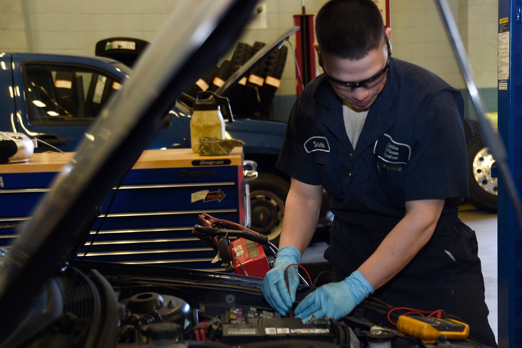 Airman 1st Class Michael Sabala, 11th Logistics Readiness Squadron vehicle maintainer, tests car fuses using a voltmeter at Joint Base Andrews, Md., April 2, 2015. A voltmeter is used to measure the amount of voltage passing between two points. (U.S. Air Force photo/Airman 1st Class Ryan J. Sonnier)