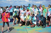 Team Malmstrom members pose for a group photo following the Wingman Month kickoff color run April 1, 2015, at Malmstrom Air Force Base, Mont. The run aimed to facilitate a fun and creative take on a wing run, with Airmen, their families and civilians taking part. (U.S. Air Force photo/Airman 1st Class Dillon Johnston)
