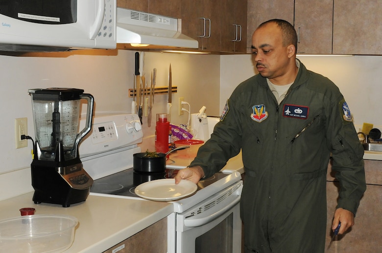 Tech. Sgt. Michael Harris, a maintainer with the 113th Wing’s Aerospace Control Alert (ACA) Detachment cooks dinner in one of the two kitchens in the self-sustainable ACA facility on March 14, 2015, after an already long first half of his 24 hour shift at the alert station. The D.C. Air National Guard’s F-16s and ready trained personnel are part of a multi-layered air defense system for the nation’s capital. The D.C. ACA Detachment reached a milestone of responding to 5,000 alert events on March 21, 2015. (Air National Guard photo by Master Sgt. Becky Vanshur)