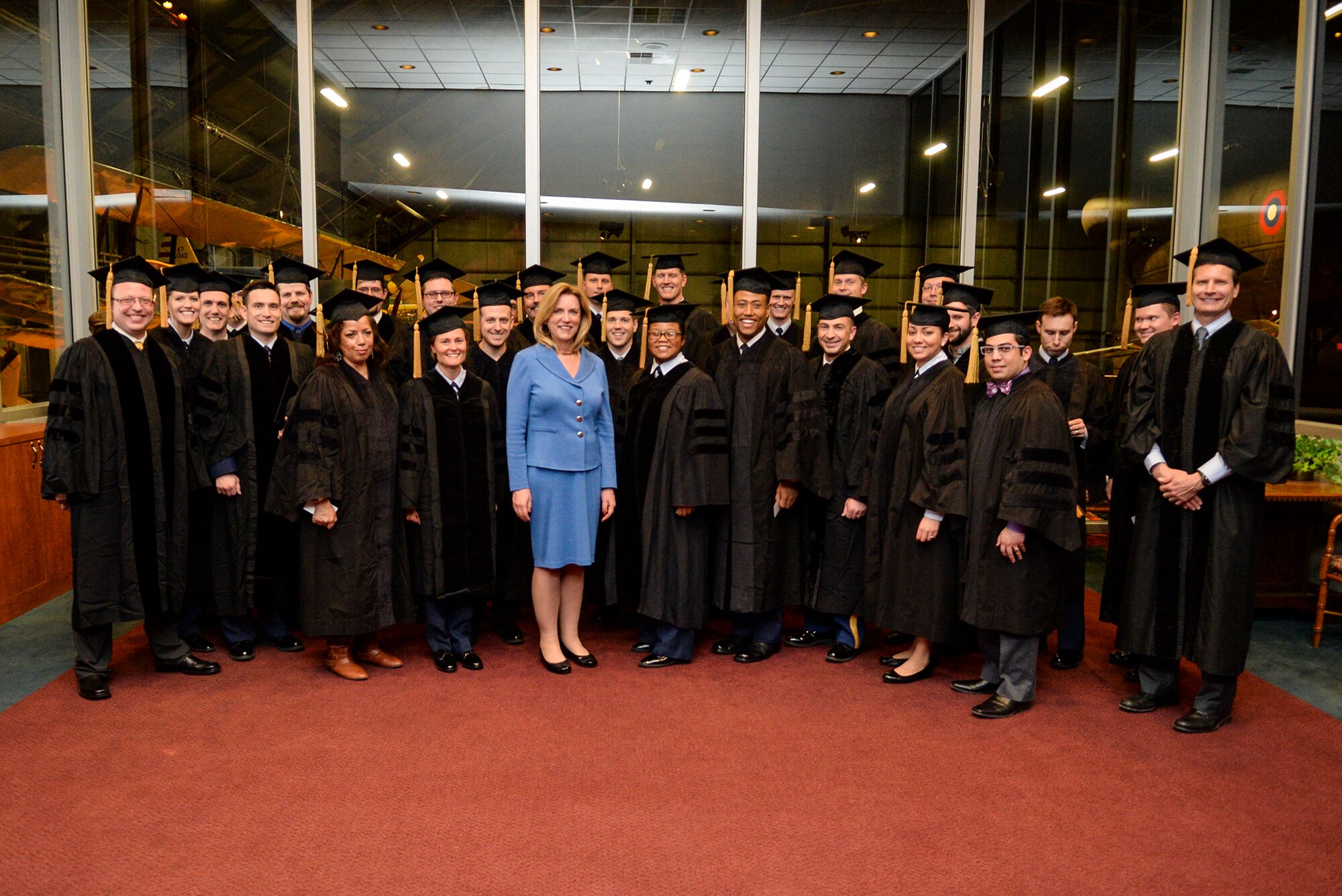 Secretary of the Air Force Deborah Lee James poses with the Ph.D. graduates from the Air Force Institute of Technology for a group photo prior to their graduation ceremony at the National Museum of the U.S. Air Force at Wright-Patterson Air Force Base March 26. James visited the school and was the keynote speaker for the graduation ceremony. (Air Force photo by Wesley Farnsworth) 