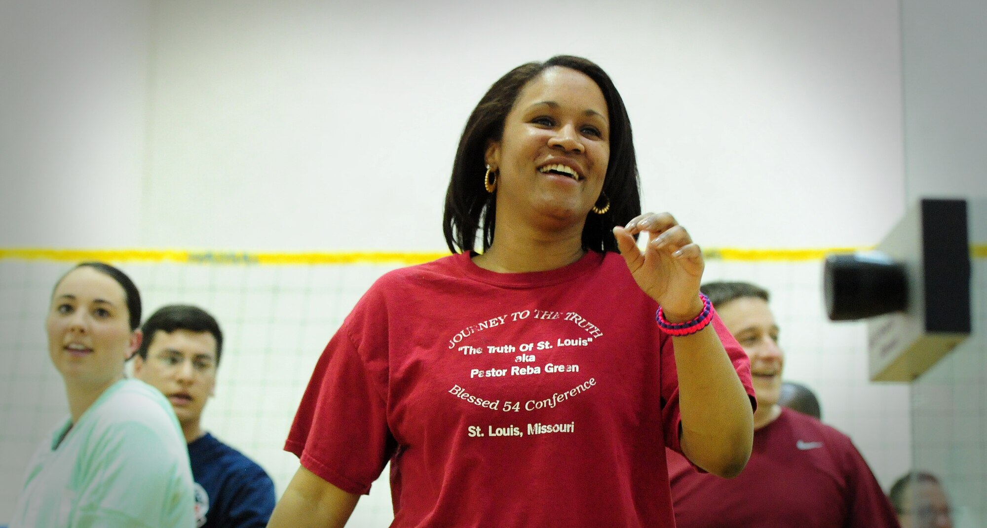 Tech. Sgt. Passion White, Detachment 303 unit training manager, celebrates after a walleyball tournament at Whiteman Air Force Base, Mo., March 27, 2015. The tournament was held as part of Whiteman Winter Olympics, where base organizations competed to be named best of the best. (U.S. Air Force photo by Staff Sgt. Nick Wilson/Released)