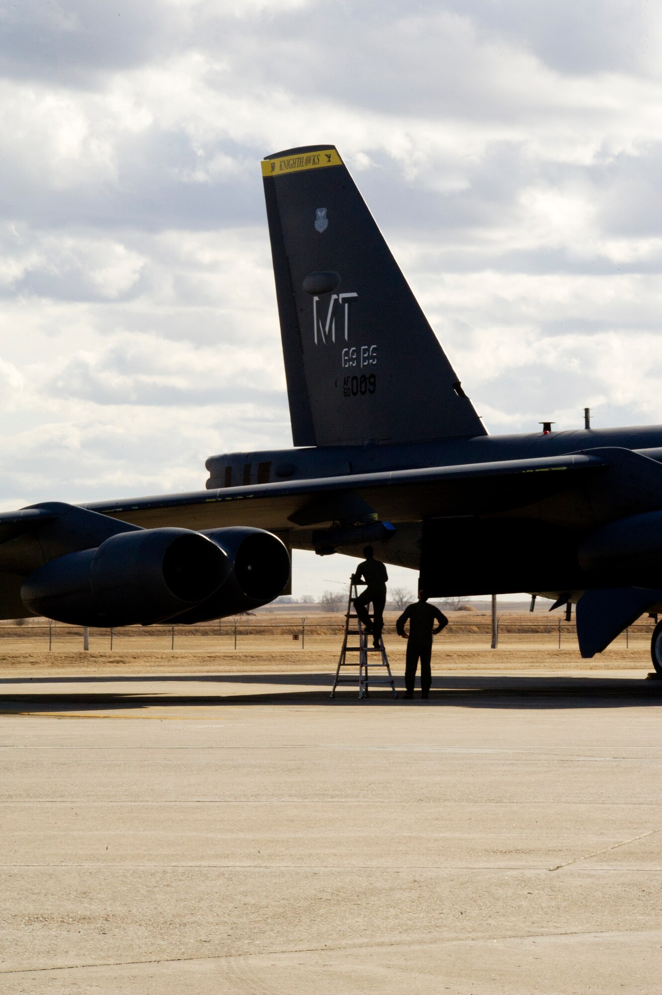 Aircrew members from the 69th Bomb Squadron perform a pre-flight check on a B-52H Stratofortress before take-off on Minot Air Force Base, N.D., April 1, 2014. The training mission, coined “POLAR GROWL”, aims to support bomber training requirements, ensuring global strike capabilities are flexible, credible and responsive to various threats.  (U.S. Air Force photo/Senior Airman Brittany Y. Bateman)