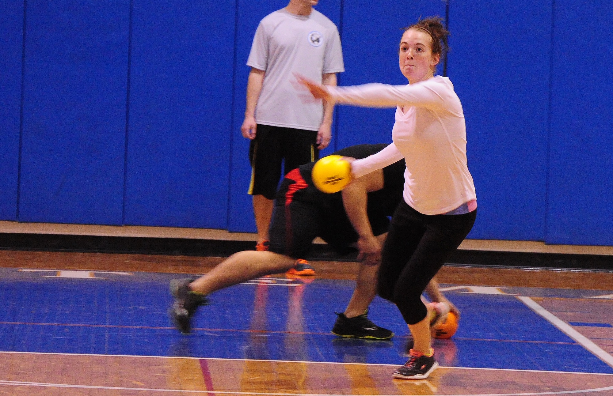 Senior Airman Ashley Engle, 509th Civil Engineer Squadron heating, ventilation, air and cooling journeyman, prepares to hit an opponent during a dodgeball tournament at Whiteman Air Force Base, Mo., March 27, 2015. The 509th CES won the Whiteman Winter Olympics Best Large Squadron award with 520 points from 18 events. (U.S. Air Force photo by Staff Sgt. Nick Wilson/Released) 