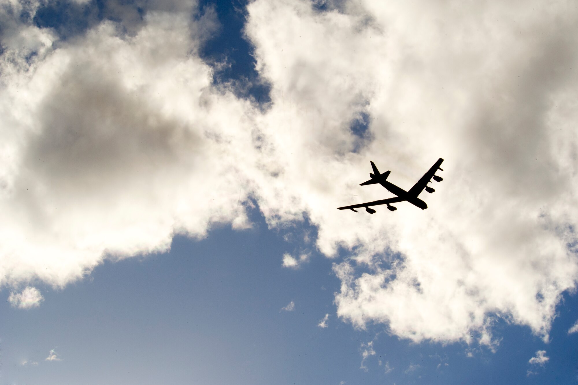 A B-52H Stratofortress flies over Minot Air Force Base, N.D. during a training mission, April 1, 2015. The training mission, coined “POLAR GROWL”, aims to provide unique training opportunities while testing the bomber force’s command and control apparatus’ ability to support two synchronized flight paths.  (U.S. Air Force photo/Senior Brittany Y. Bateman)