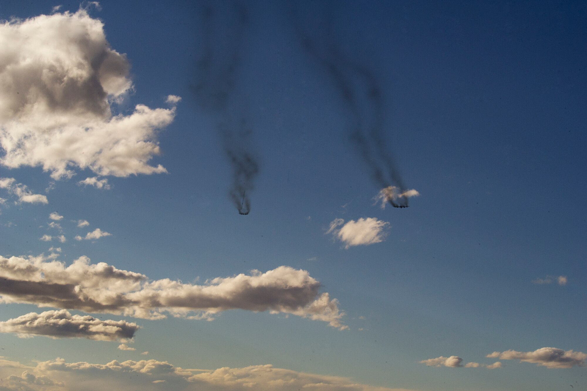 Two B-52H Stratofortresses fly over Minot Air Force Base, N.D. during a training mission, April 1, 2015. The training mission, coined “POLAR GROWL”, aims to provide unique training opportunities while testing the bomber force’s command and control apparatus’ ability to support two synchronized flight paths.  (U.S. Air Force photo/Senior Brittany Y. Bateman)