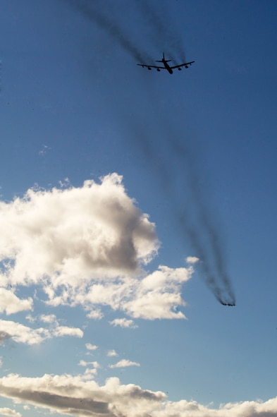 Two B-52H Stratofortresses fly over Minot Air Force Base, N.D. during a training mission, April 1, 2015. The training mission, coined “POLAR GROWL”, aims to provide unique training opportunities while testing the bomber force’s command and control apparatus’ ability to support two synchronized flight paths.  (U.S. Air Force photo/Senior Brittany Y. Bateman)