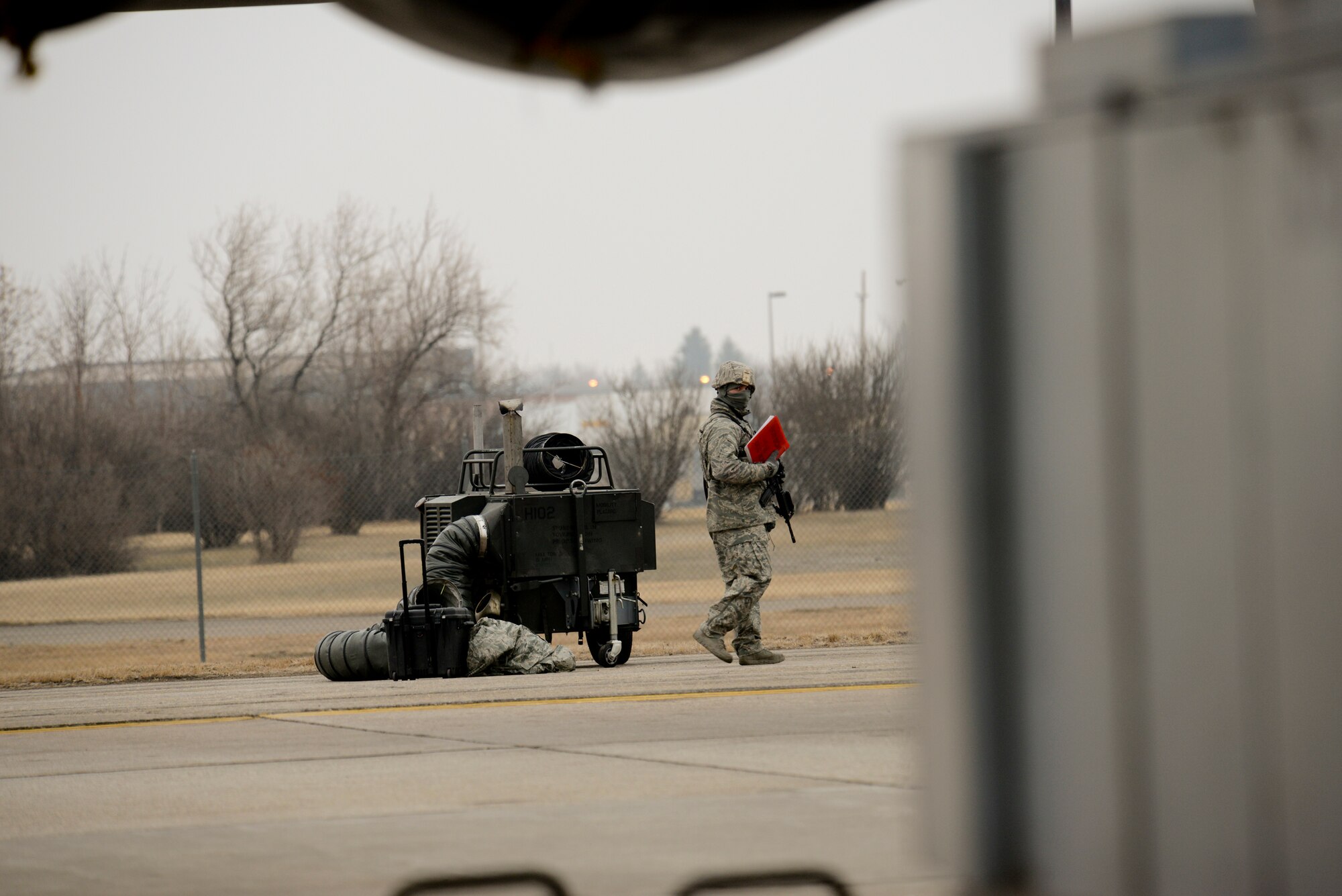 An Airman from the 5th Security Forces Squadron provides security during an exercise on Minot Air Force Base, N.D., March 24, 2015. Air Force Global Strike Command routinely conducts training operations and exercises to ensure its forces can perform their mission when called upon at any time. (U.S. Air Force photo/Senior Airman Brittany Y. Bateman)