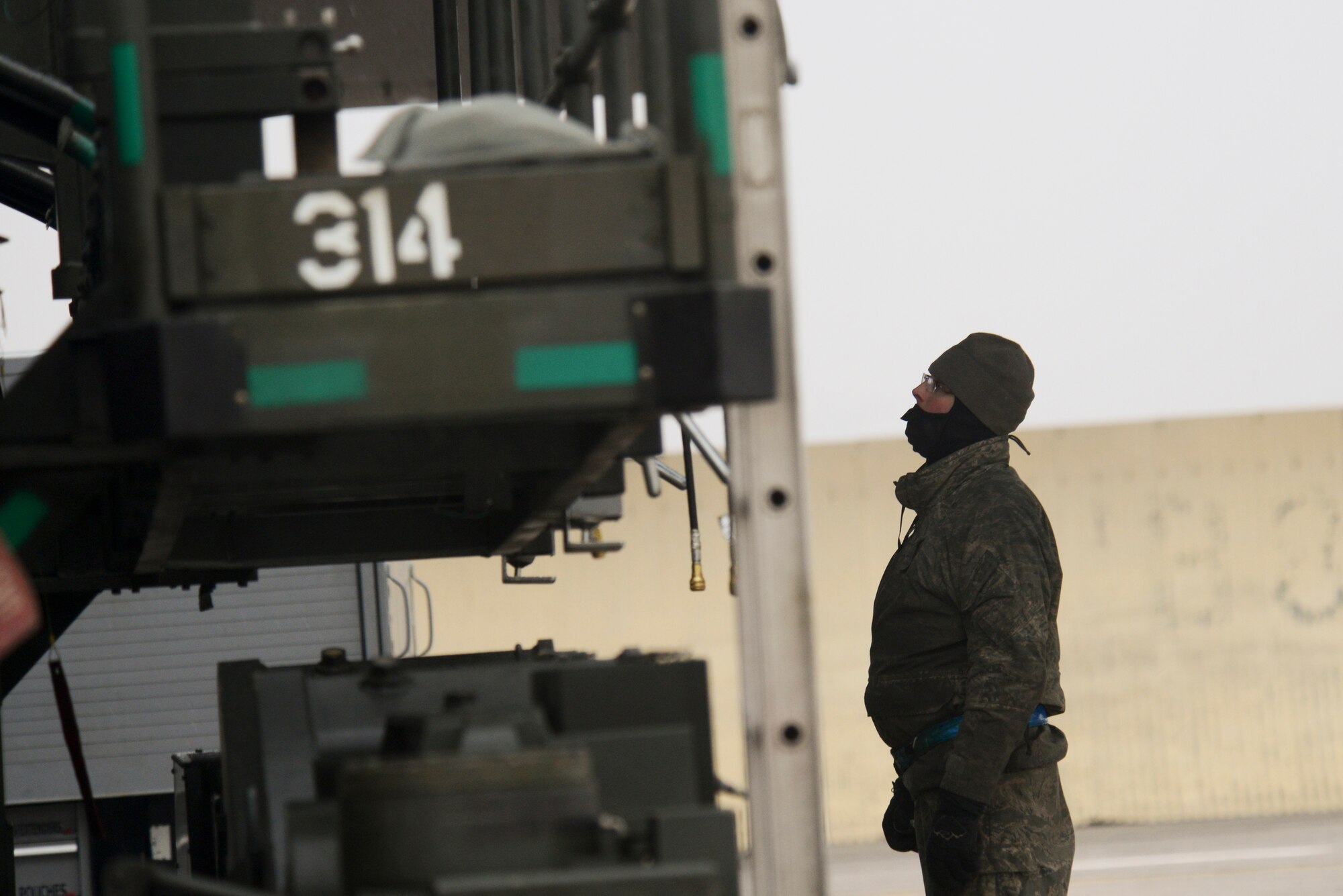 Airmen from the 5th Aircraft Maintenance Squadron load weapons on a B-52H Stratofortress during an exercise on Minot Air Force Base, N.D., March 24, 2015. The exercise provides training opportunities for forces to deter and, if necessary, defeat a military attack against the United States. (U.S. Air Force photo/Senior Airman Brittany Y. Bateman) 