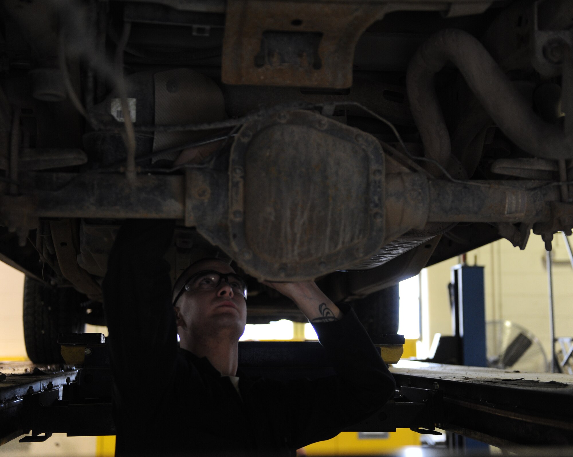 Senior Airman Justin Van Dyke, 5th Logistics Readiness Squadron vehicle maintenance journeyman, troubleshoots a rear speed sensor on a security forces government-operated vehicle on Minot Air Force Base, N.D., April 2, 2015. When junior Airmen first arrive to the shop, they are tasked with performing novice jobs such as oil changes, filter changes and pressure washing the vehicles. (U.S. Air Force photo/Senior Airman Kristoffer Kaubisch)