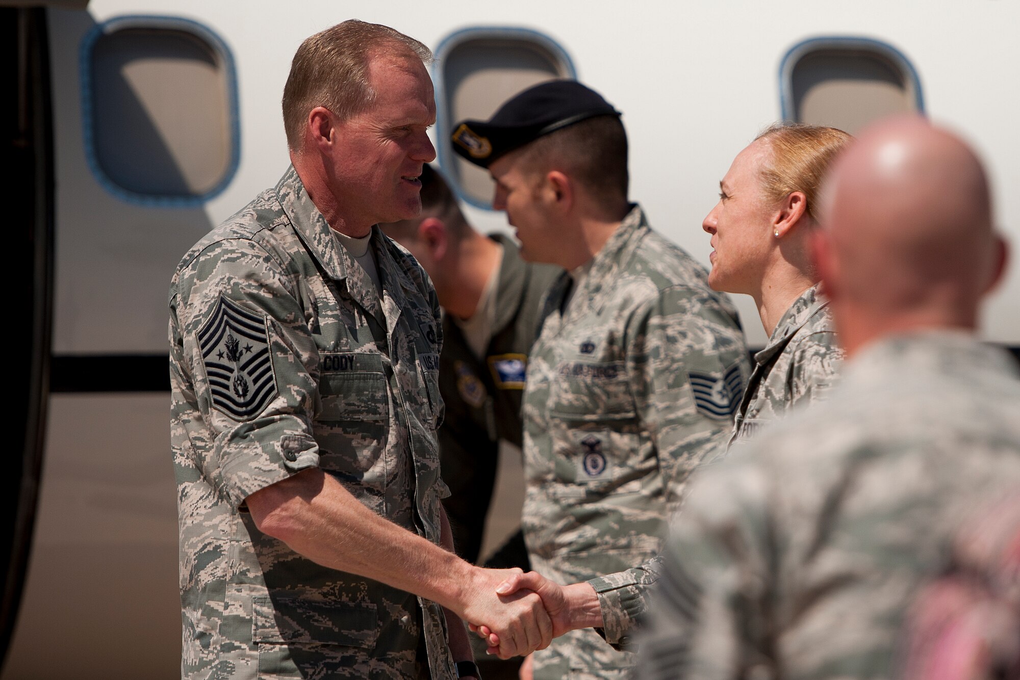 SAN ANGELO, Texas - Chief Master Sgt. of the Air Force James Cody shakes 
hands with Col. Kimberlee P. Joos, 17th Training Wing Commander, after 
arriving at Mathis Field April 2. Cody arrived in town to visit Goodfellow Air 
Force Base Airmen and speak about the changes of today's Air Force. (U.S. Air 
Force photo/ Airman 1st Class Devin Boyer)
