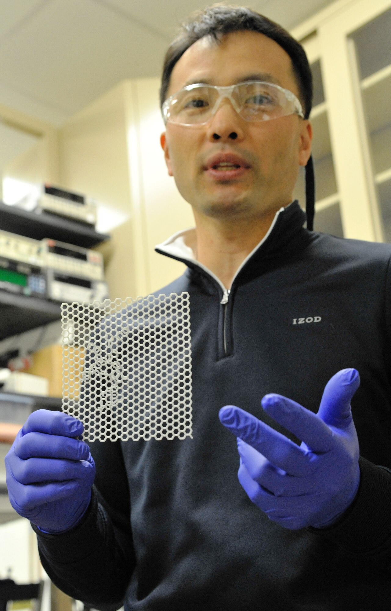Air Force Research Laboratory Materials and Manufacturing Directorate research scientist Steve Kim displays a 3D model of graphene, a type of carbon that can be used in developing nanoelectronic sensors for human-performance monitoring. Graphene has unique, natural electronic binding properties that are allowing Air Force scientists at AFRL/RX, Wright-Patterson Air Force Base, to develop a low-cost, manufacturable bio-sensing platform that is capable of achieving ultrasensitive molecular detection. (Air Force photo by Michele Eaton)  
