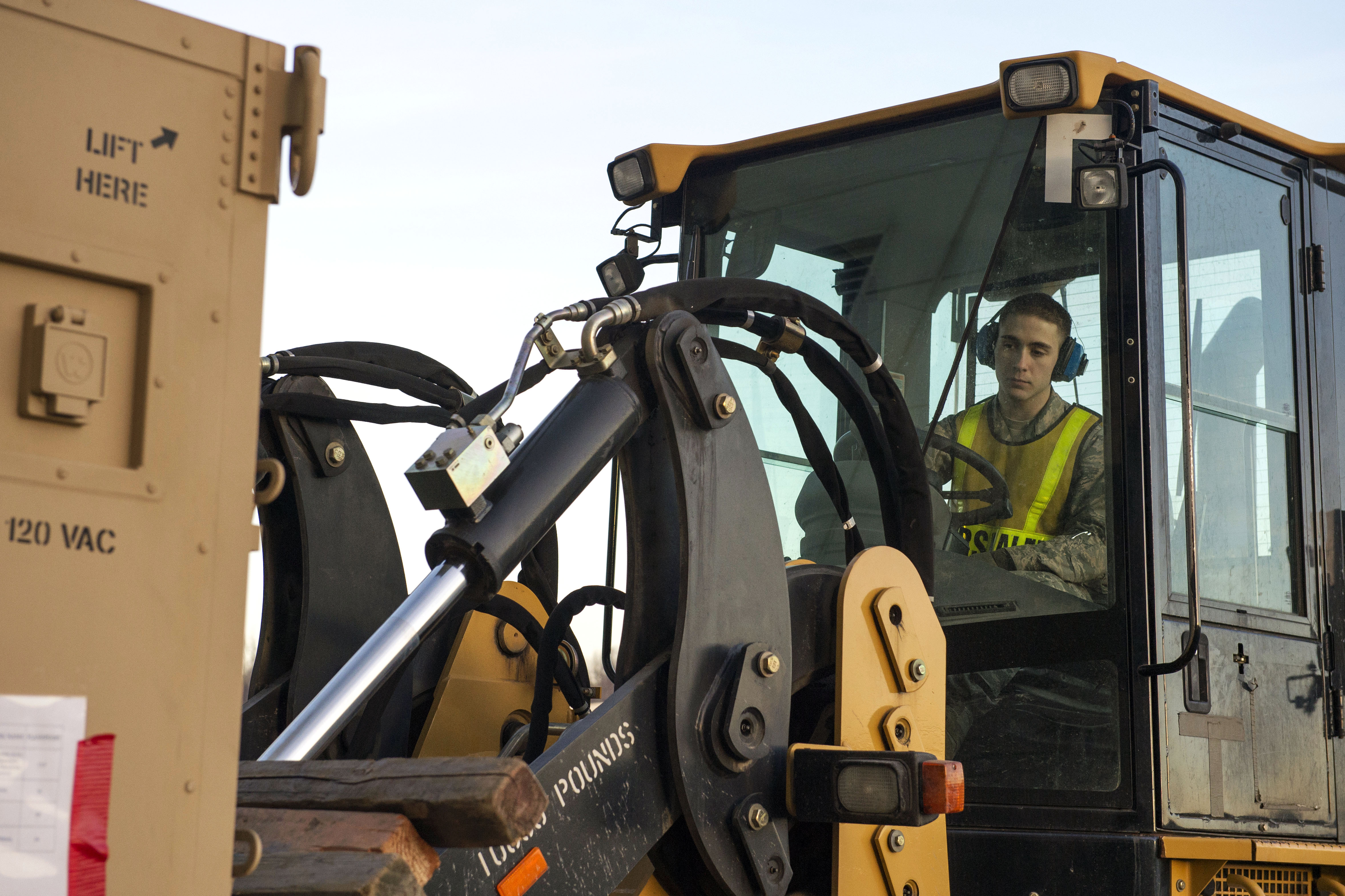 Air Force Airman 1st Class Nicholas Wunsch operates a forklift during