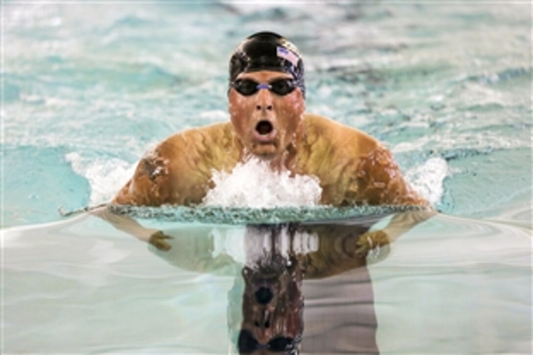 Army Staff Sgt. Max Hasson competes in the men's 100 breaststroke during the 2015 Army Trials swimming competition at the aquatics training center on Fort Bliss in El Paso, Texas, April 2, 2015.  About 100 wounded, ill or injured soldiers and veterans are on the base to train and compete in various athletic events, which will help determine who will get a spot on the Army's team for the Defense Department Warrior Games 2015 in June on Marine Corps Base Quantico, Va.