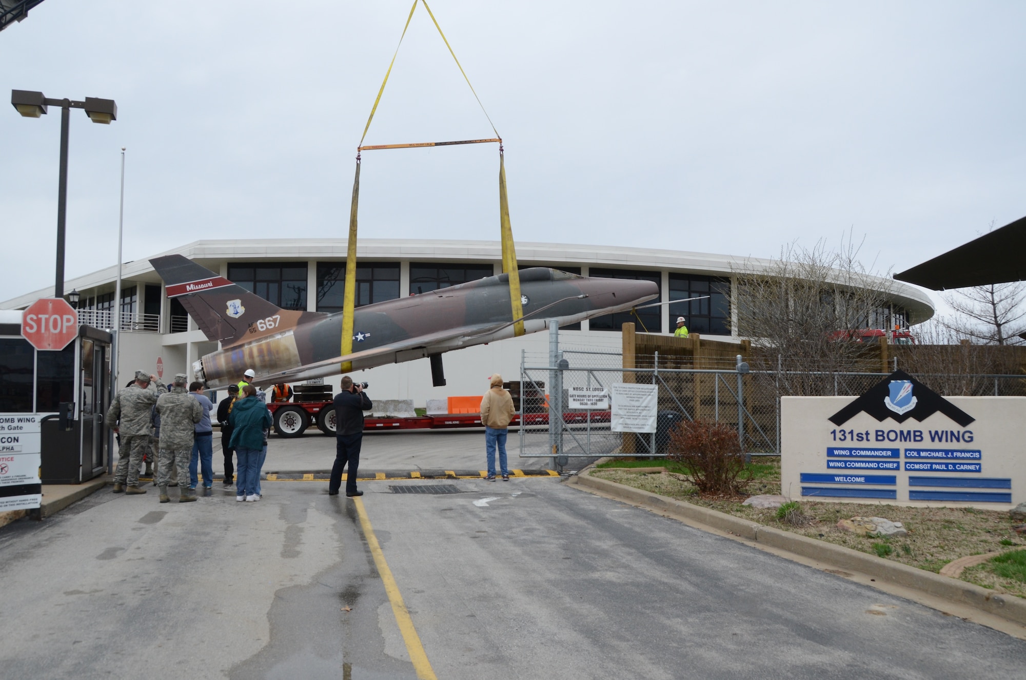 An F-100 Super Sabre jet (AF55-667) on static display at the Missouri Air National Guard’s 131st Bomb Wing base at Lambert-St. Louis International Airport, is removed from its pedestal, April 3, 2015. A total of three static display aircraft, including an F-15A Eagle and an F-4 Phantom II, will be transported to a new home at the planned 131st Bomb Wing Heritage Park at Whiteman Air Force Base, Mo. (U.S. Air National Guard photo by Senior Master Sgt. Mary-Dale Amison)