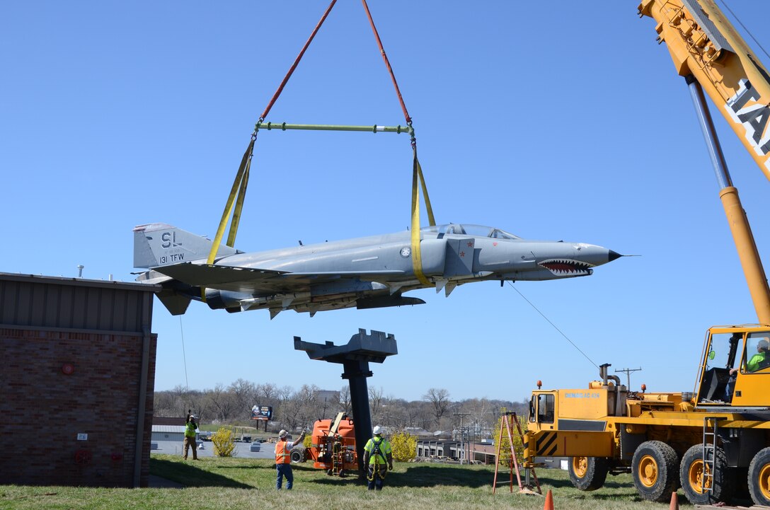 An F-4 Phantom II jet (AF68-338) on static display at the Missouri Air National Guard’s 131st Bomb Wing base at Lambert-St. Louis International Airport, is removed from its pedestal, March 31, 2015. A total of three static display aircraft, including an F-15A Eagle and an F-100 Super Sabre, will be transported to a new home at the planned 131st Bomb Wing Heritage Park at Whiteman Air Force Base, Mo. (U.S. Air National Guard photo by Senior Master Sgt. Mary-Dale Amison)