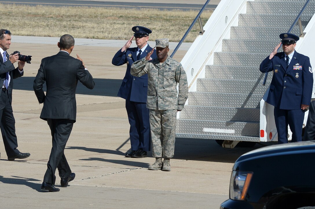 Air Force Col. Ronald E. Jolly Sr., center right, commander of the 75th Air Base Wing, salutes President Barack Obama as Obama prepares to depart from Hill Air Force Base in Davis County, Utah, April 3, 2015.